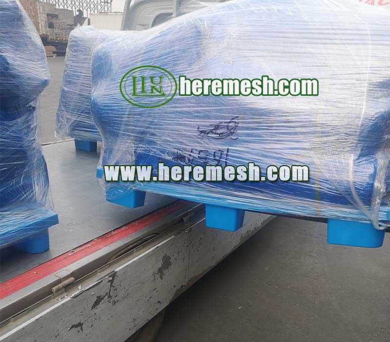 large outdoor animal mesh is loaded onto the truck